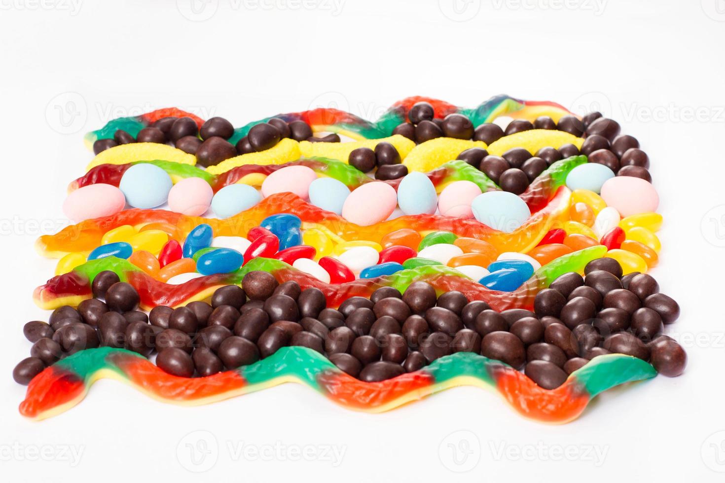 Colorful candy, lollipop and sweets isolated on white background. Top view. Selective focus. photo