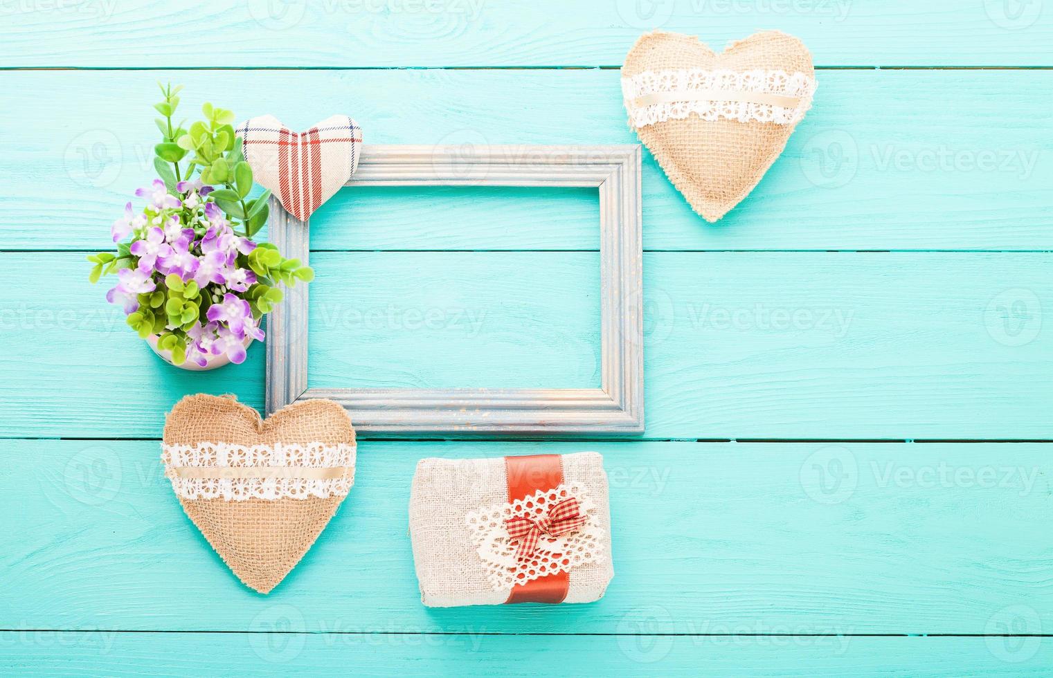 Romantic accessories on blue wooden background with copy space.Top view photo