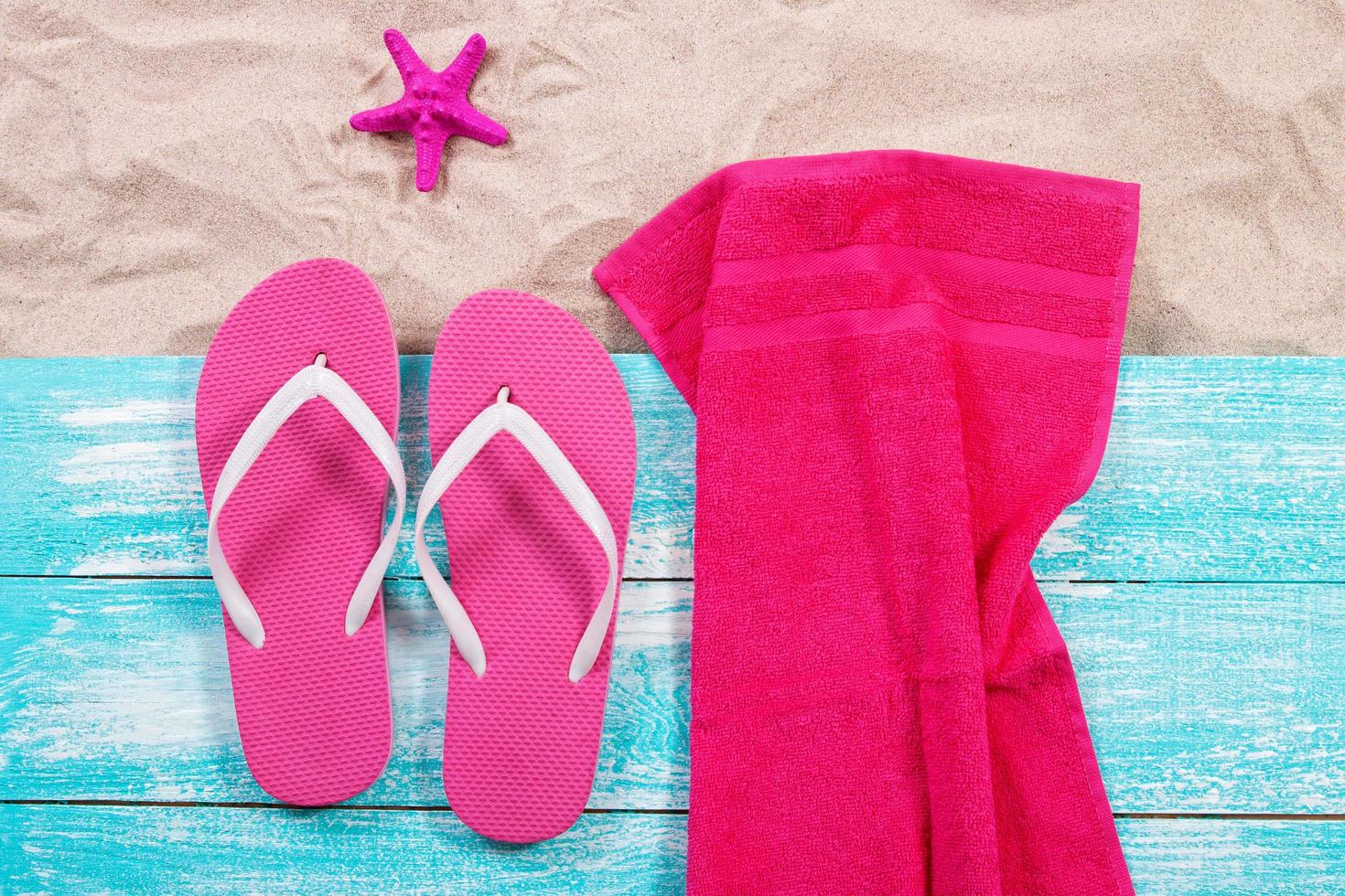 Sand copy space. Sand background top view.Beach towel, beach slippers and starfish photo