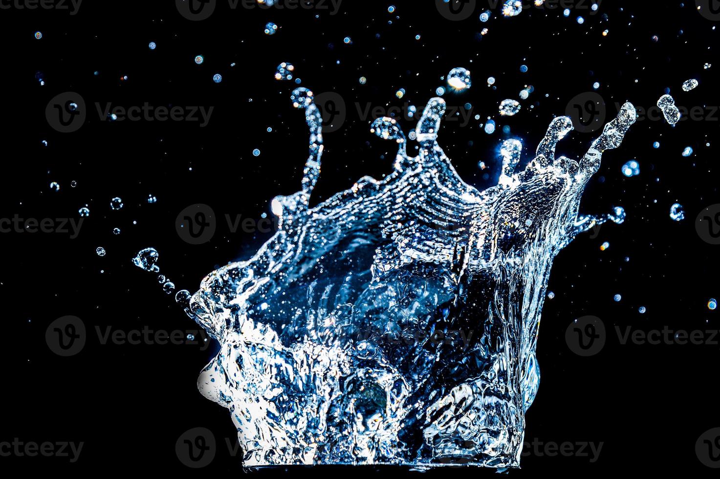 Abstract background of Water splashing on a black background. idea for freshness photo