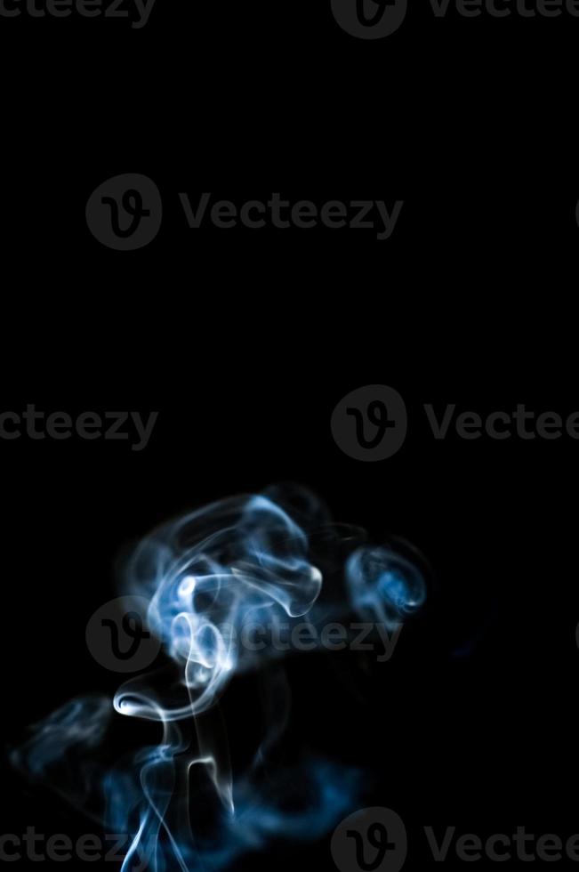 abstract background of smoke or fog on black background photo