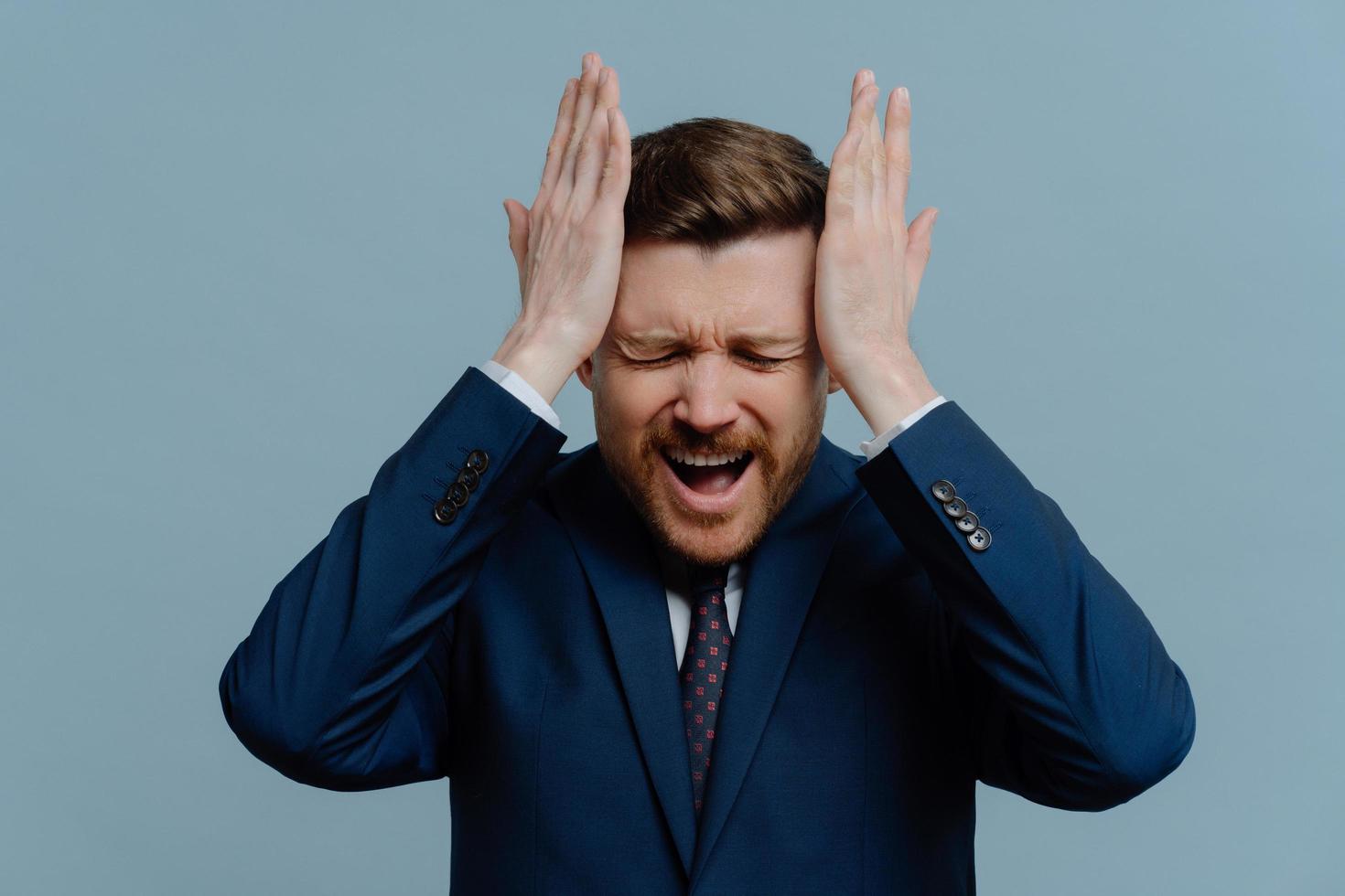 Unhappy stressed businessman receiving bad negative news photo