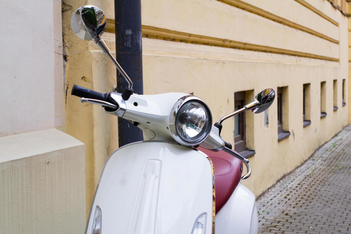 Vintage scooter on the old europe streets photo