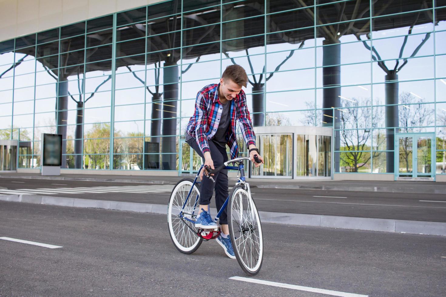 Cyclist man riding fixed gear sport retro bike. photo