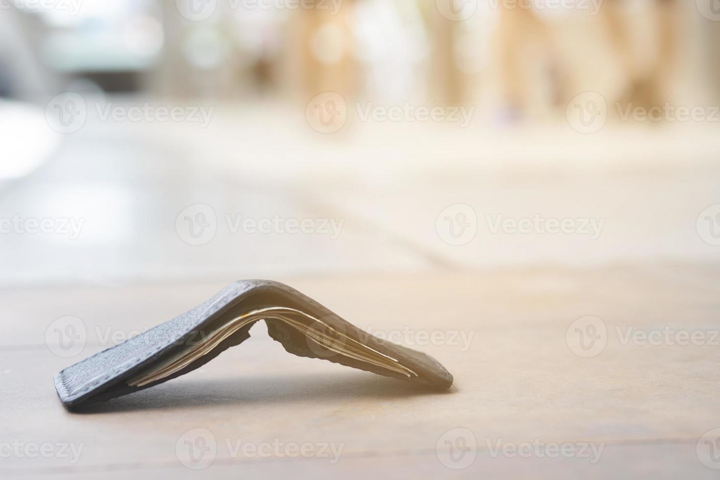 Is the wallet falling on the walkway, will it be collected photo