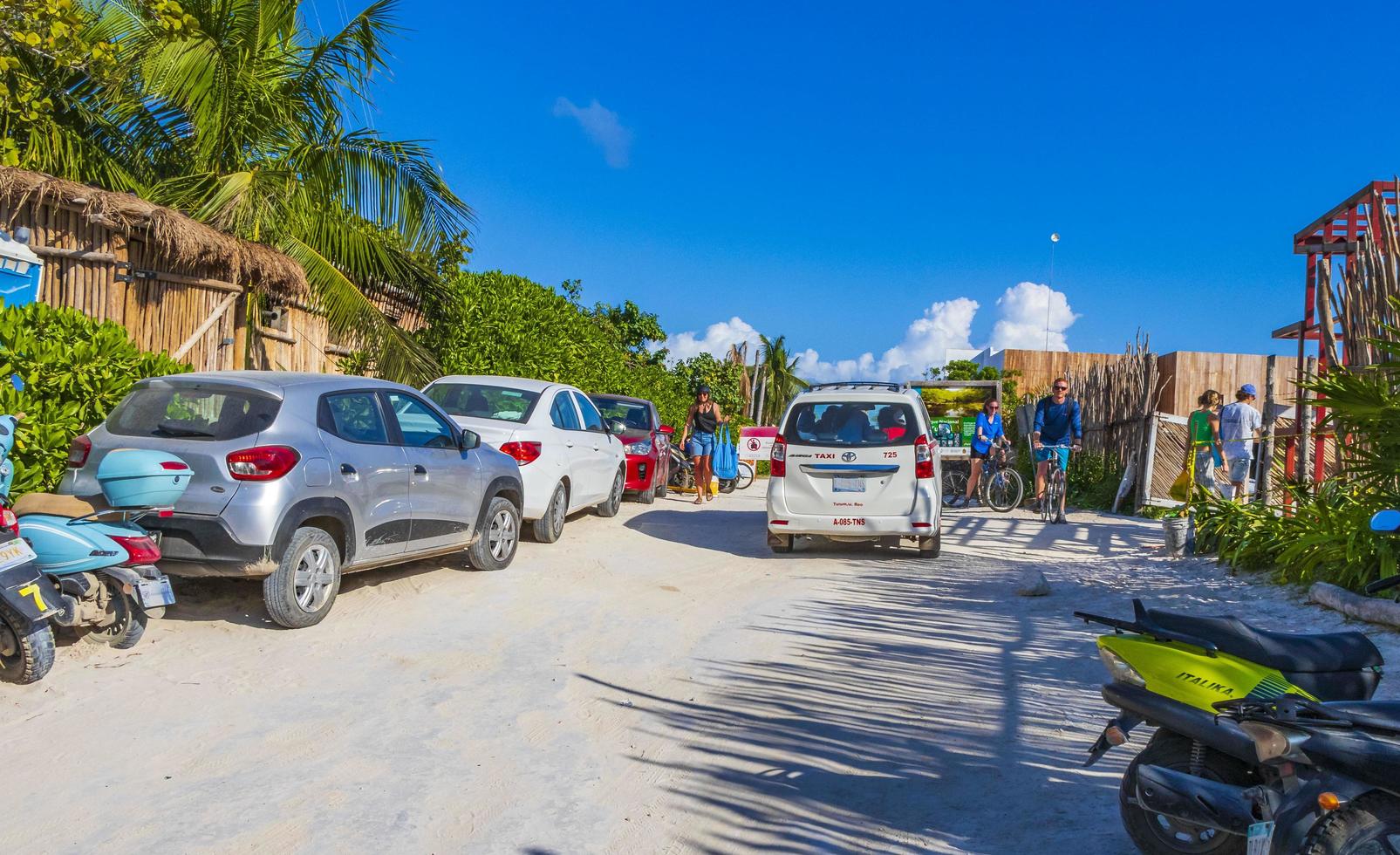 Tulum Quintana Roo Mexico 2022 Entrance to caribbean coast beach with parked cars Tulum Mexico. photo