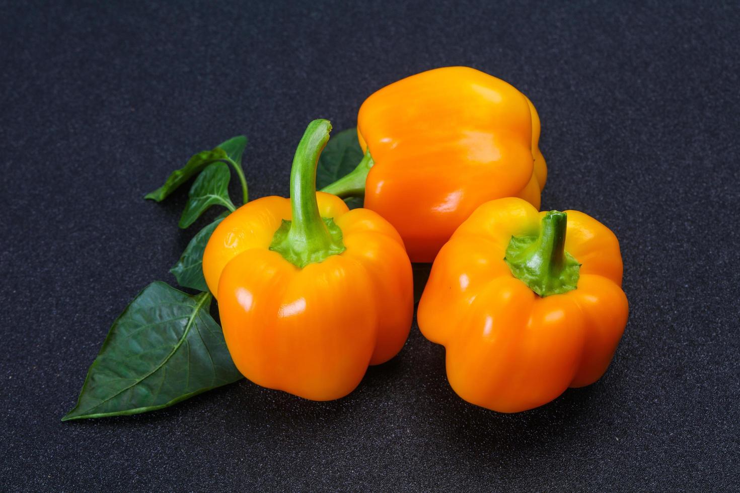 Yellow Bell pepper with leaves photo