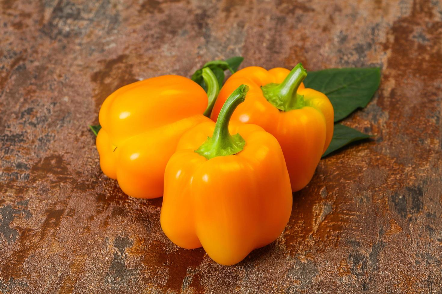 Yellow Bell pepper with leaves photo