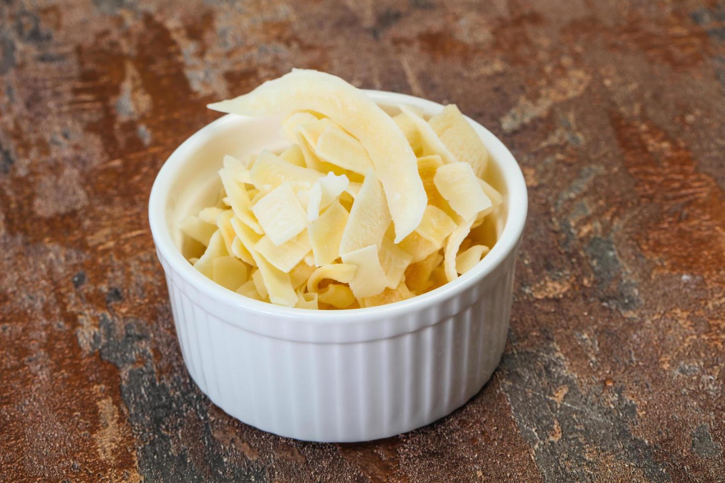 Coconut dry chips in the bowl photo