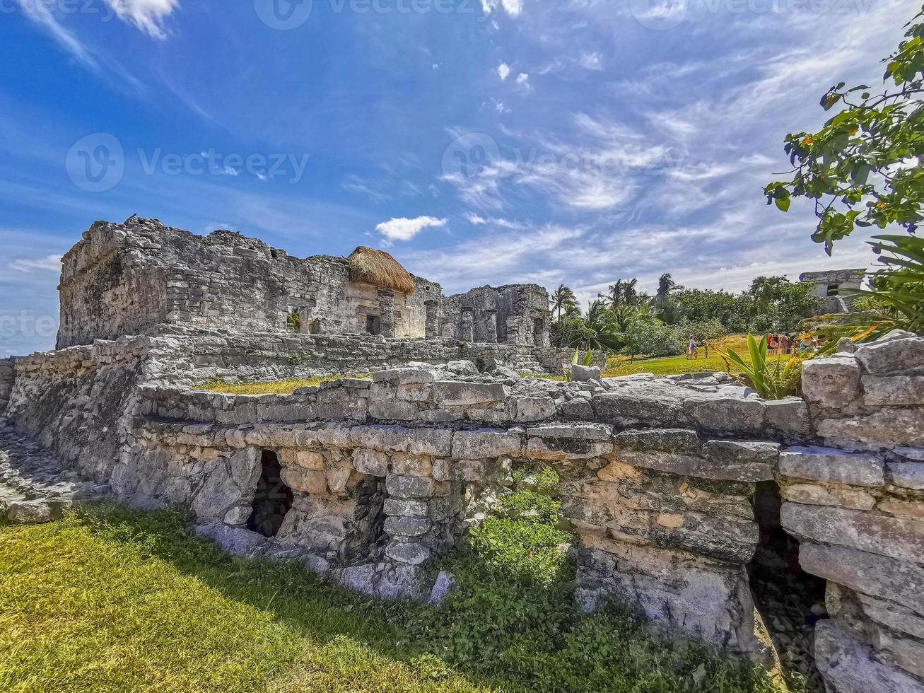 Ancient Tulum ruins Mayan site temple pyramids artifacts seascape Mexico. photo