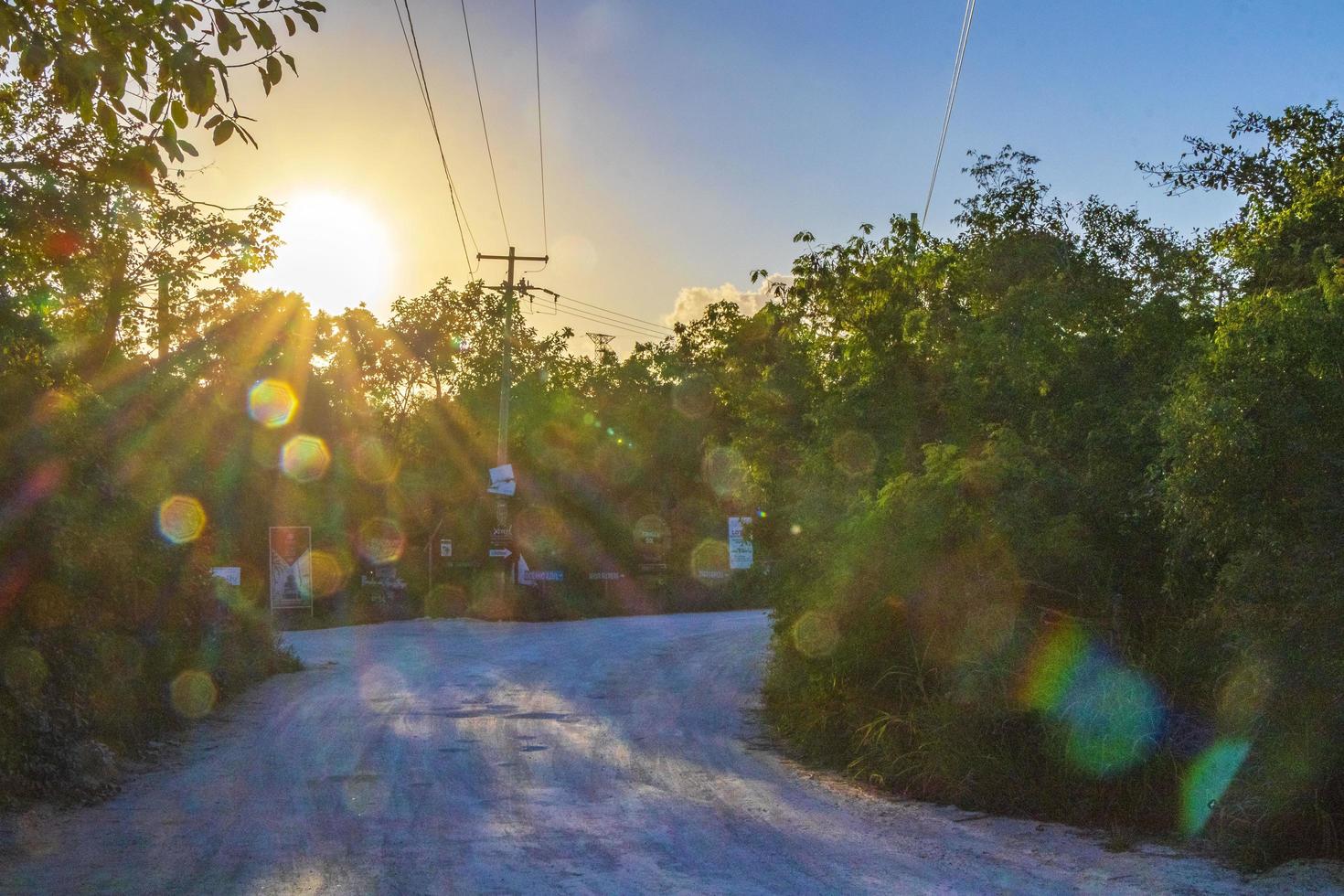 Entrance sunset and walking path cave sinkhole cenote Chemuyil Mexico. photo