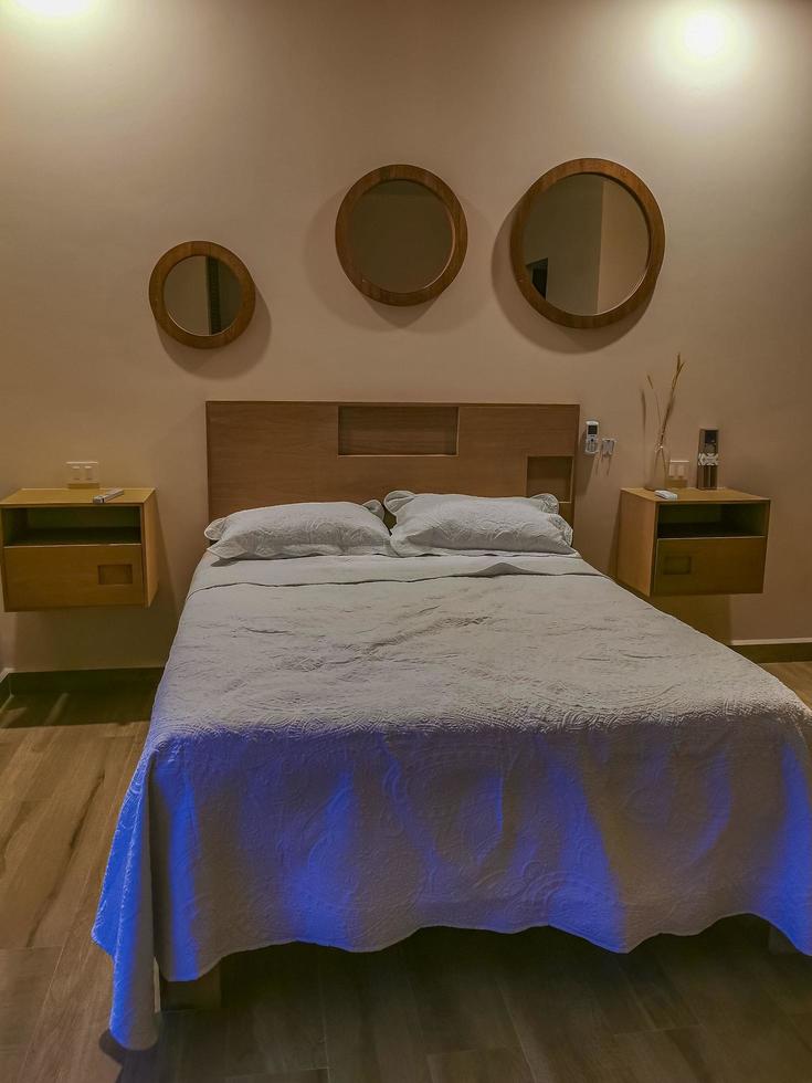 Playa del Carmen Quintana Roo Mexico 2022 Hotel room apartment with bed dark night with light Mexico. photo