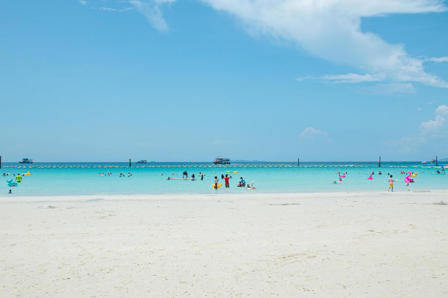 Tourists enjoying the sea and clear skies at Koh Larn, Pattaya, Thailand. photo