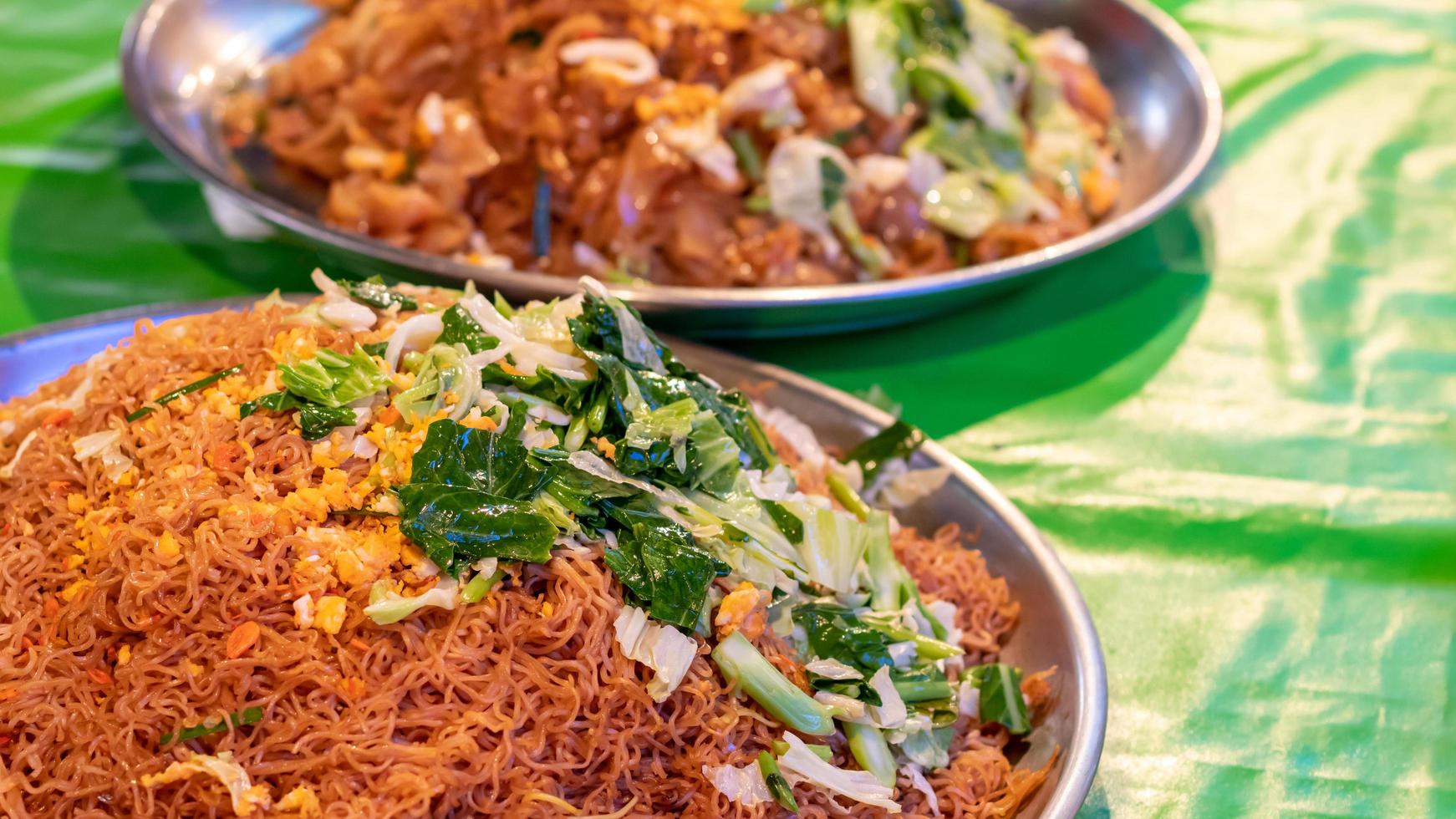 Fried noodles with many vermicelli and vegetables. photo