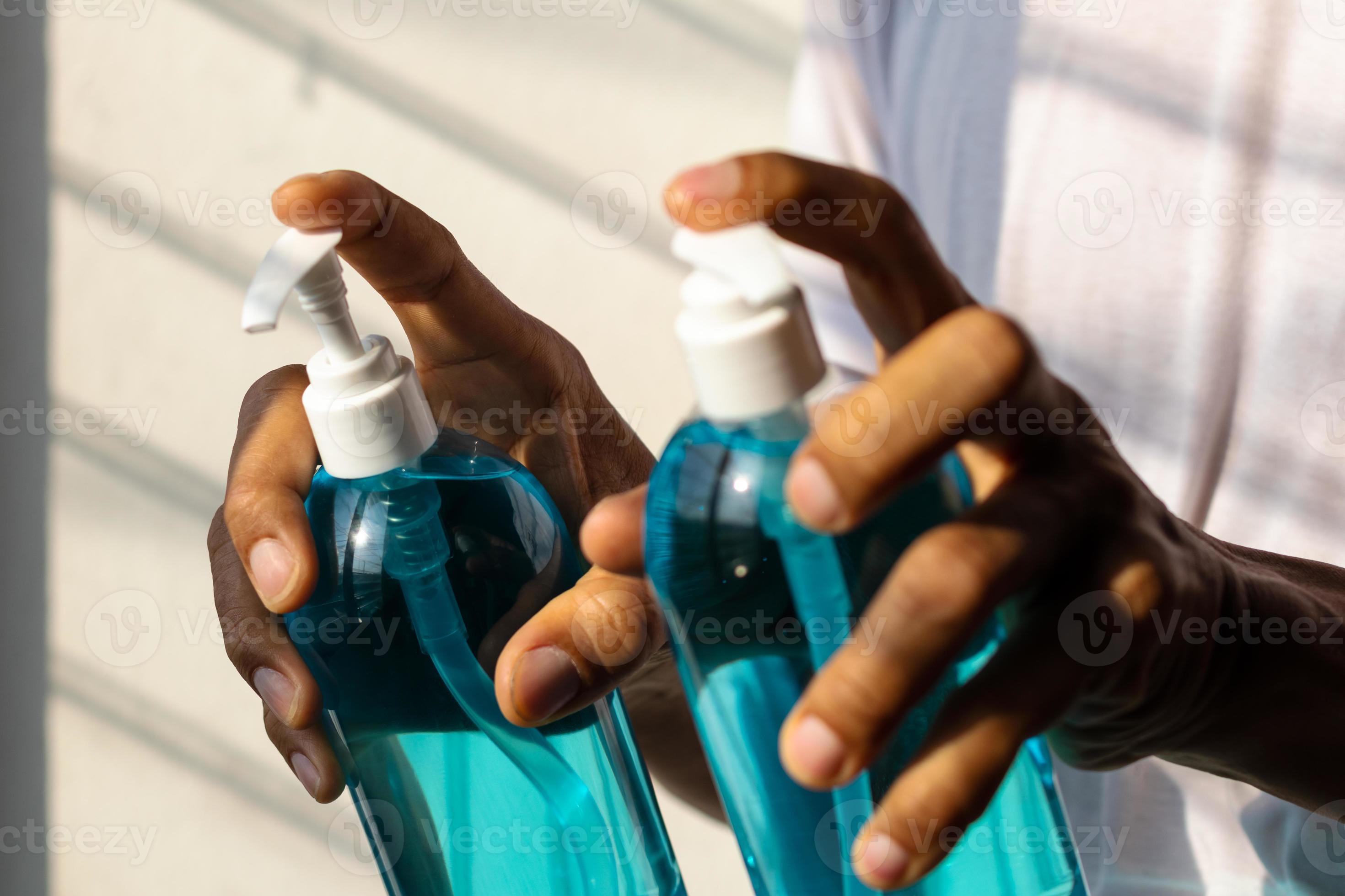 Carrying a bottle of alcohol with sunlight in the window. 7664814 Stock