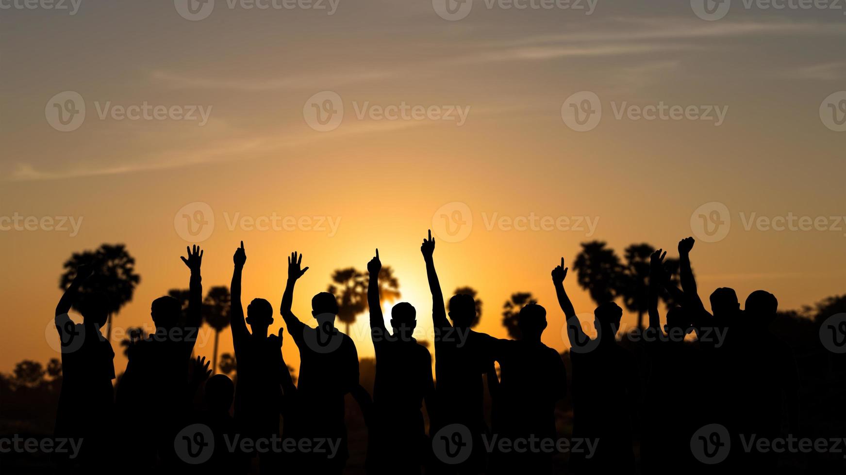 Silhouettes of people holding hands and sunrise. photo