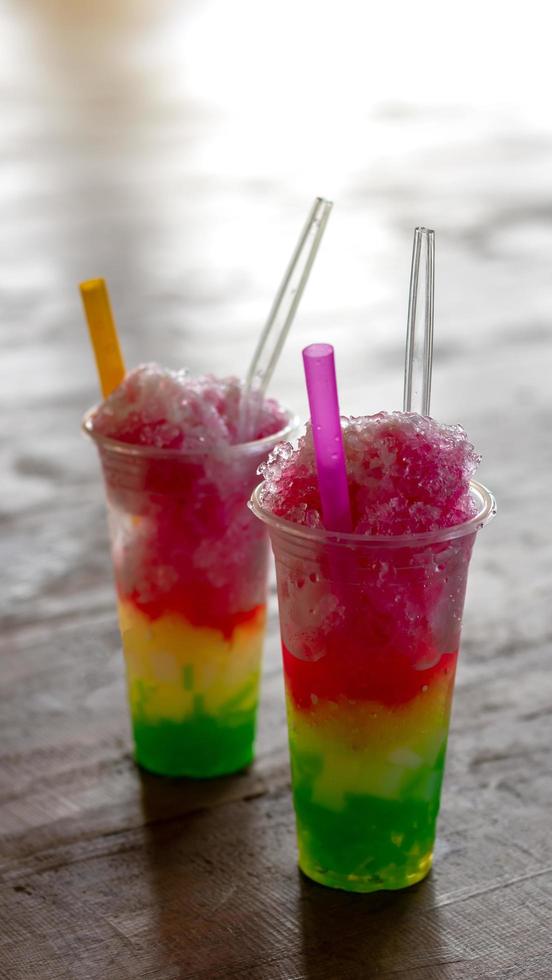 Colorful smoothie ice in a clear glass. photo