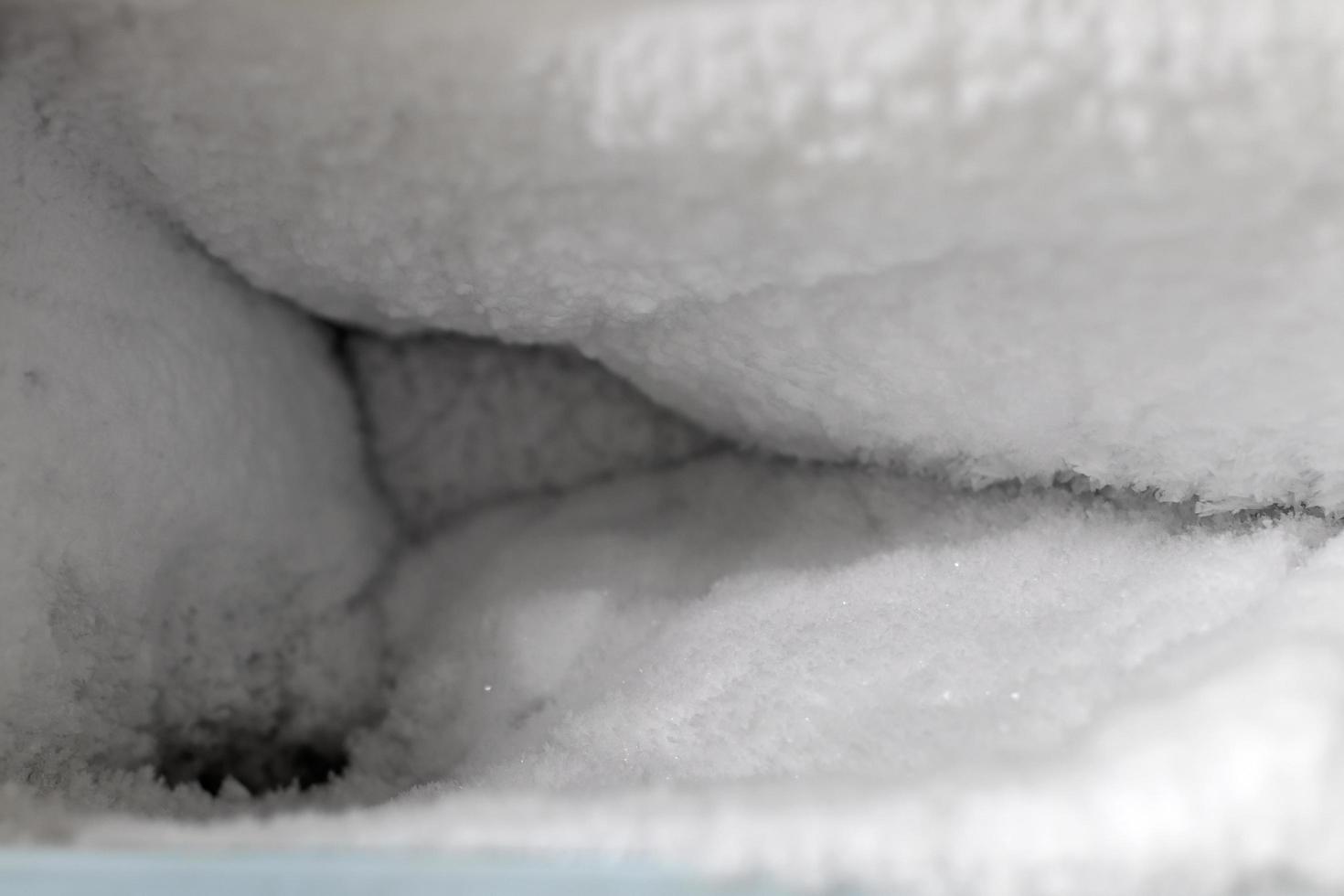 Lots of ice in the freezer of the old refrigerator. photo