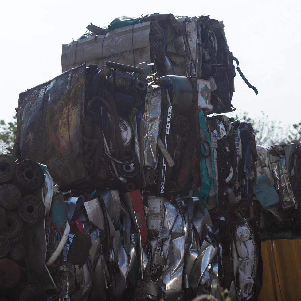 Steel scraps compressed into cubes, preparing to be recycled. photo