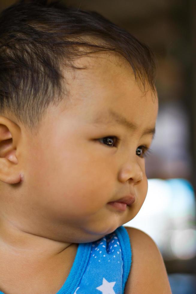 Curious and smiling faces of children photo