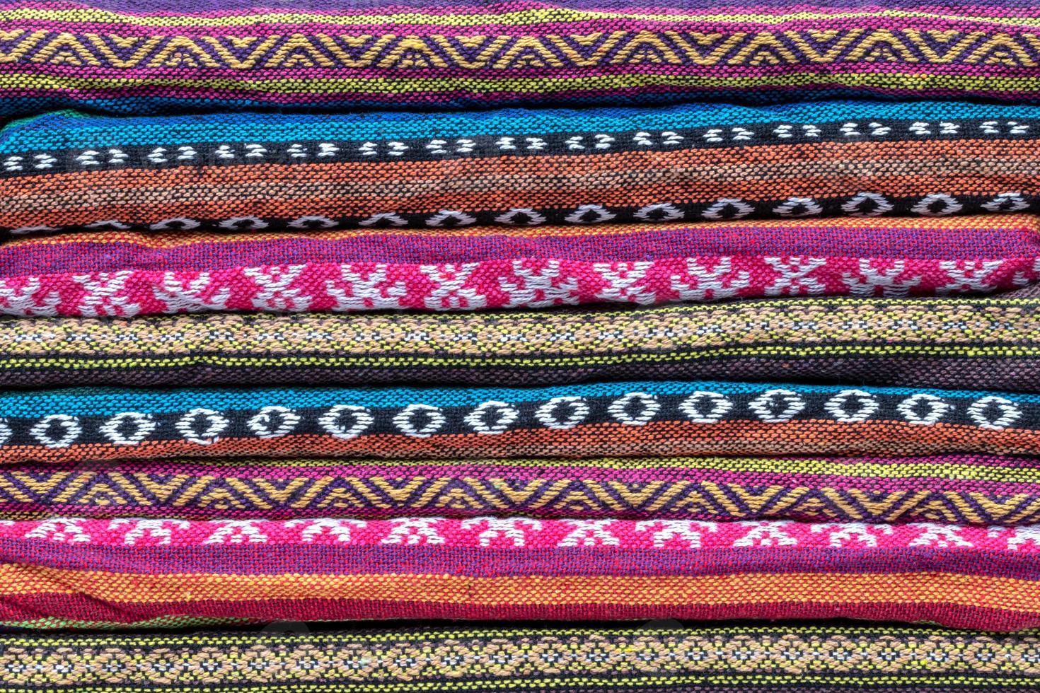 Folded colorful patterned scarves. photo