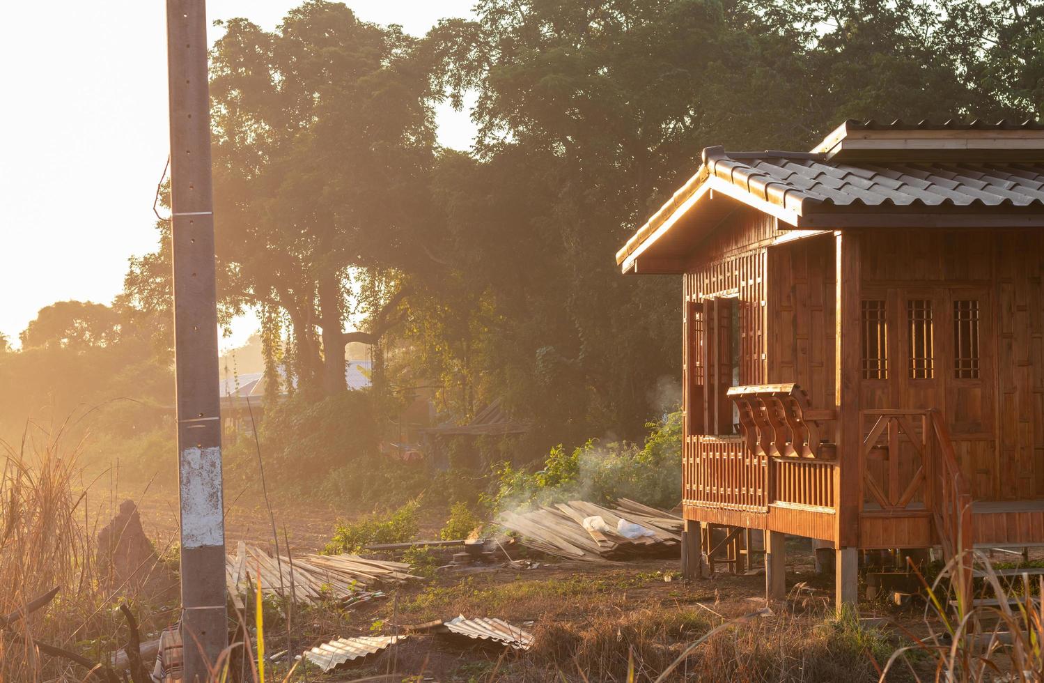 Small wooden house with sunshine in the Thai countryside. photo