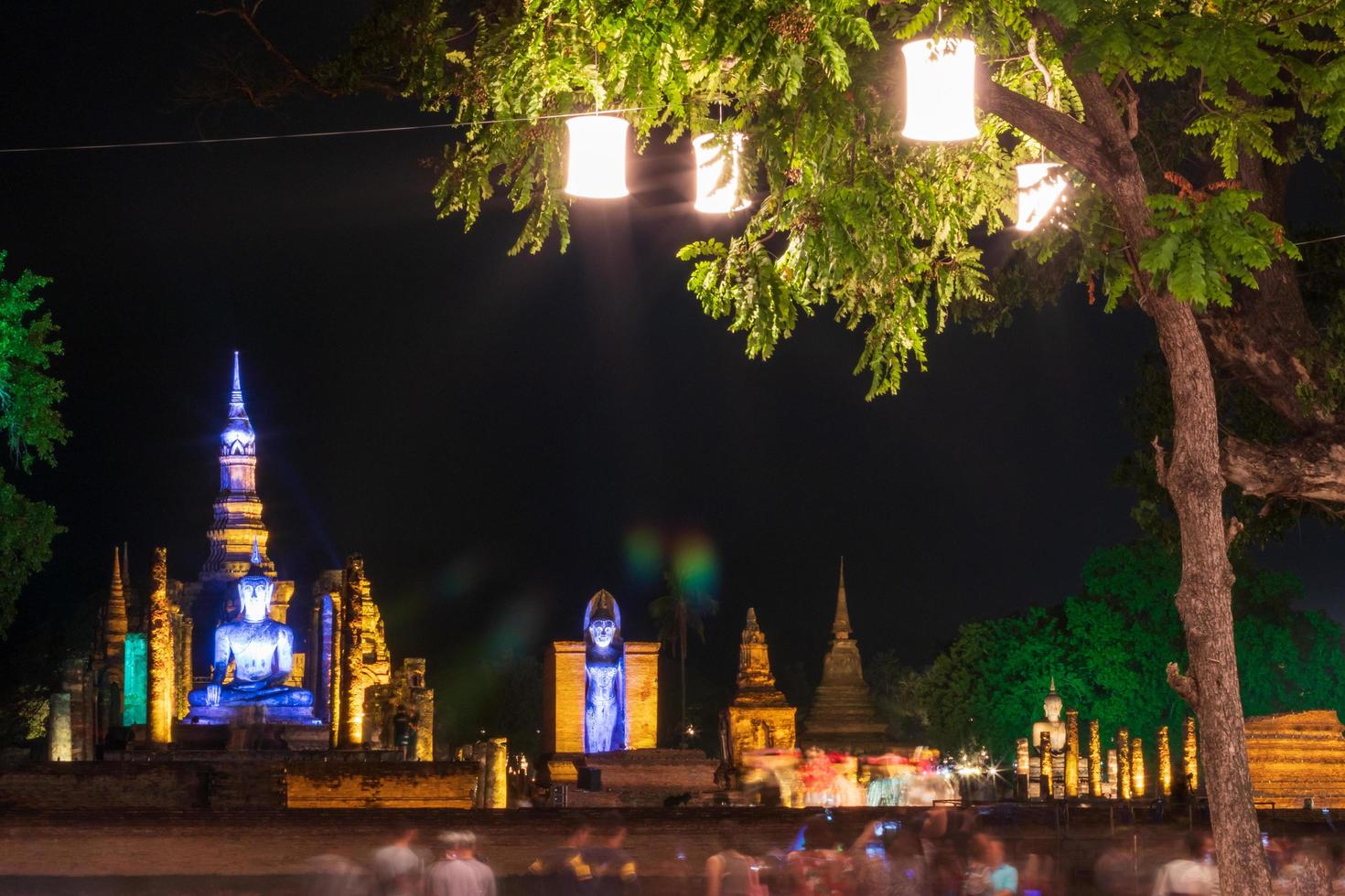 Old Buddhist architecture with lanterns hanging trees. photo