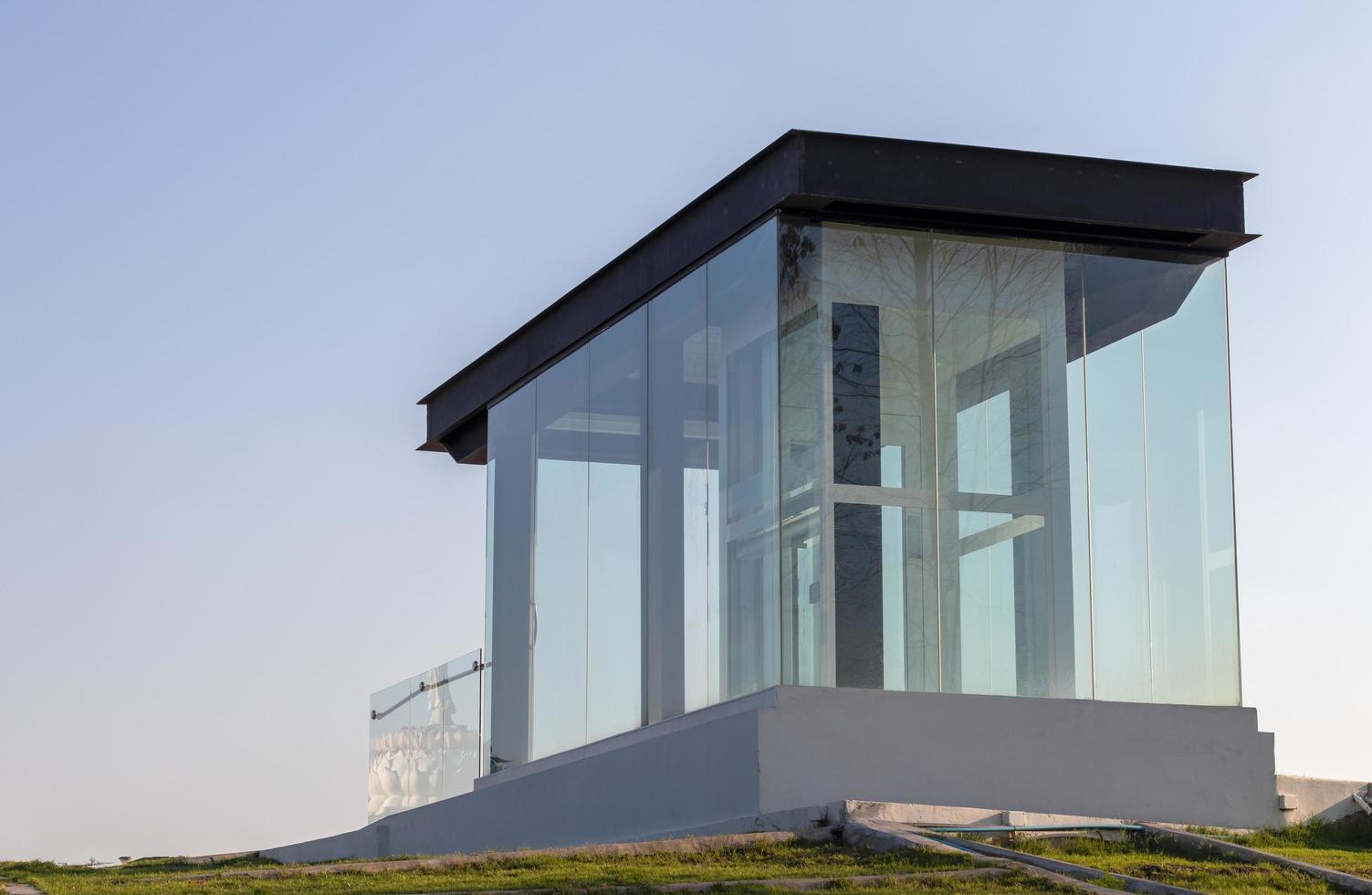 Low angle glass room during the day. photo