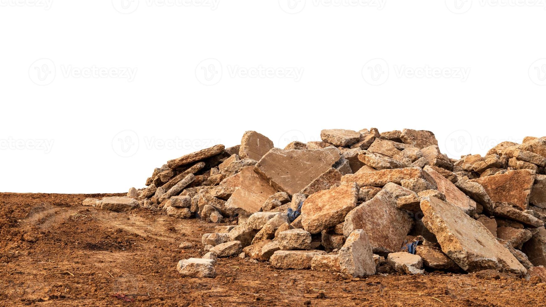 Isolated view of concrete debris piles on the ground. photo