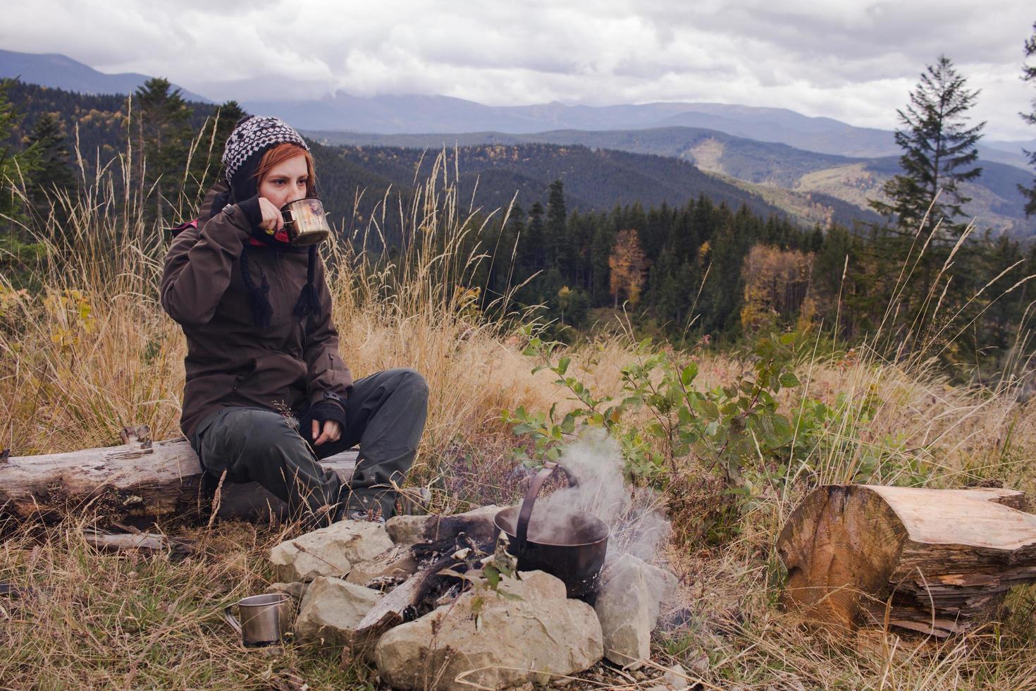 young woman hiker in autumn forest photo