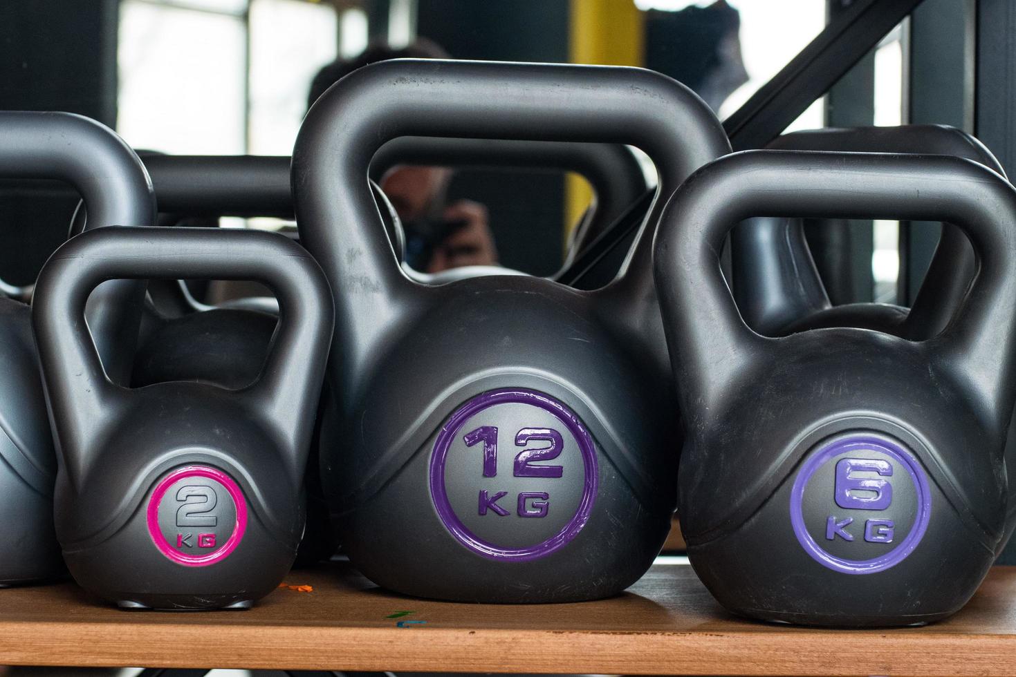 Many random plastic kettlebells photo