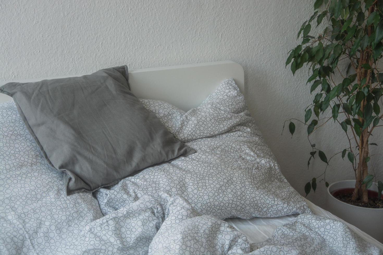 close up of pillows on comfortable bed photo