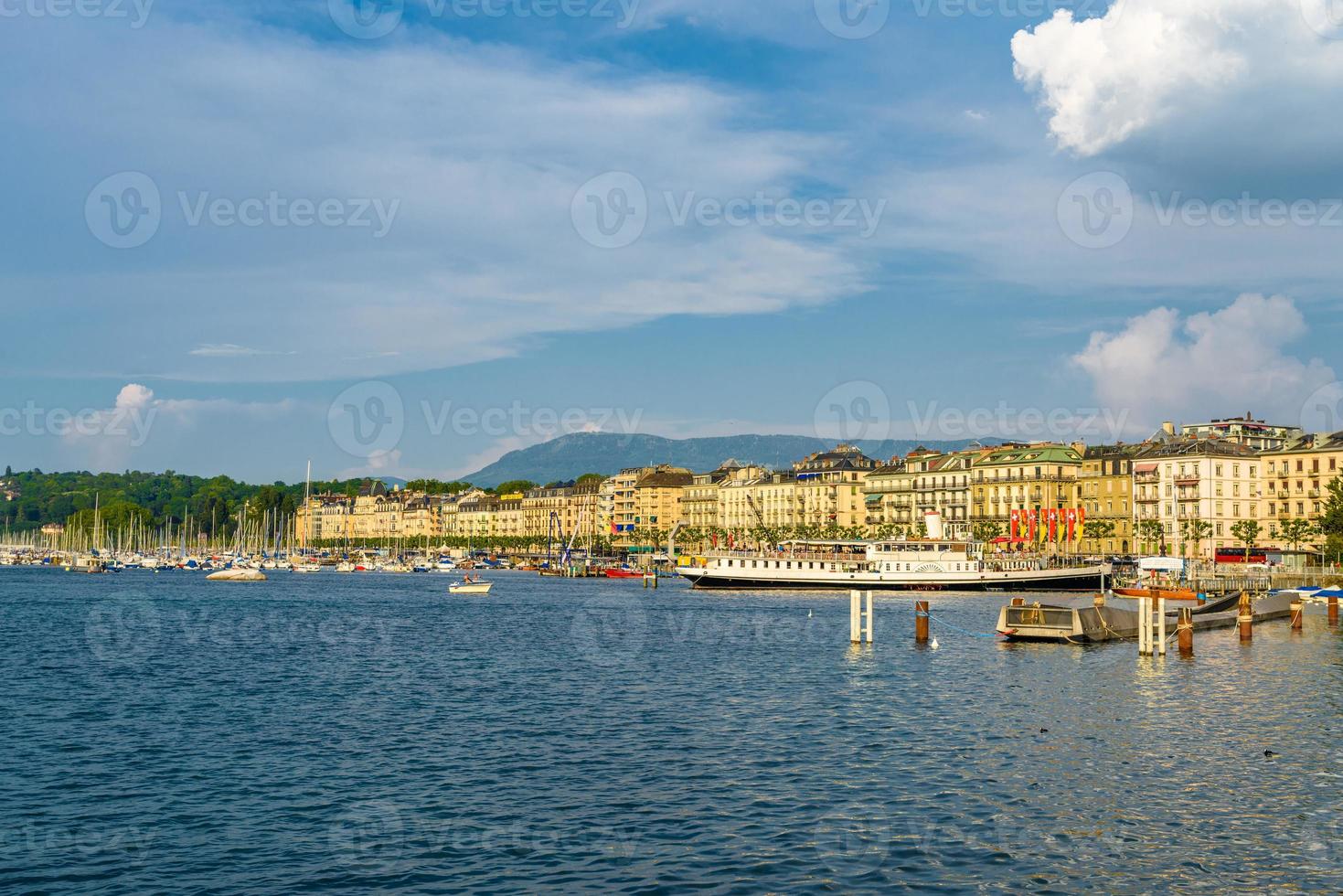 Shore of clear Geneva lake in Switzerland photo