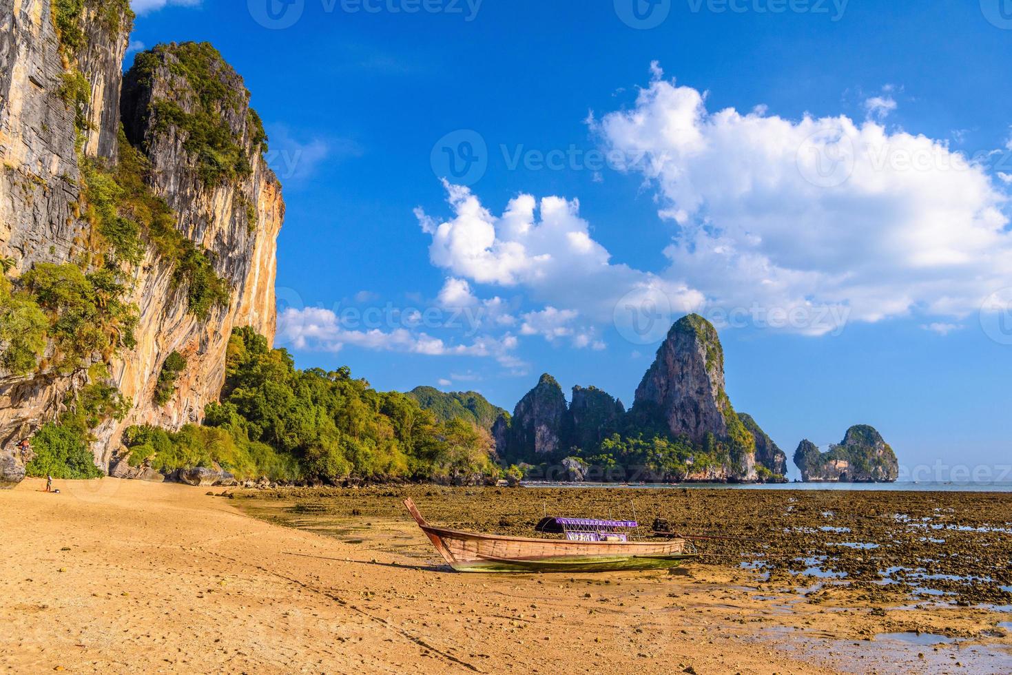 Low tide water and boats in sunset on Tonsai Bay, Railay Beach, photo