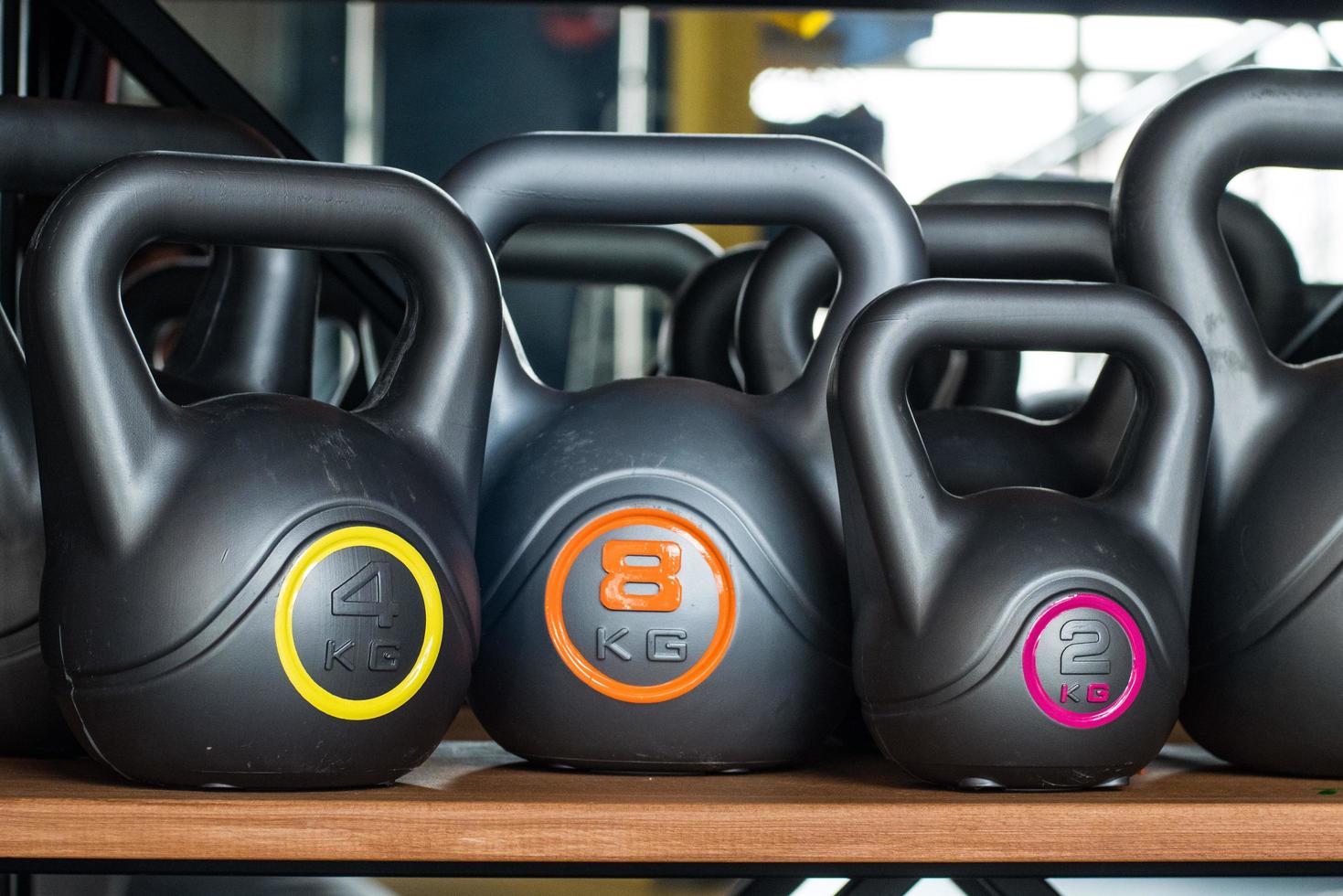 Many random plastic kettlebells photo