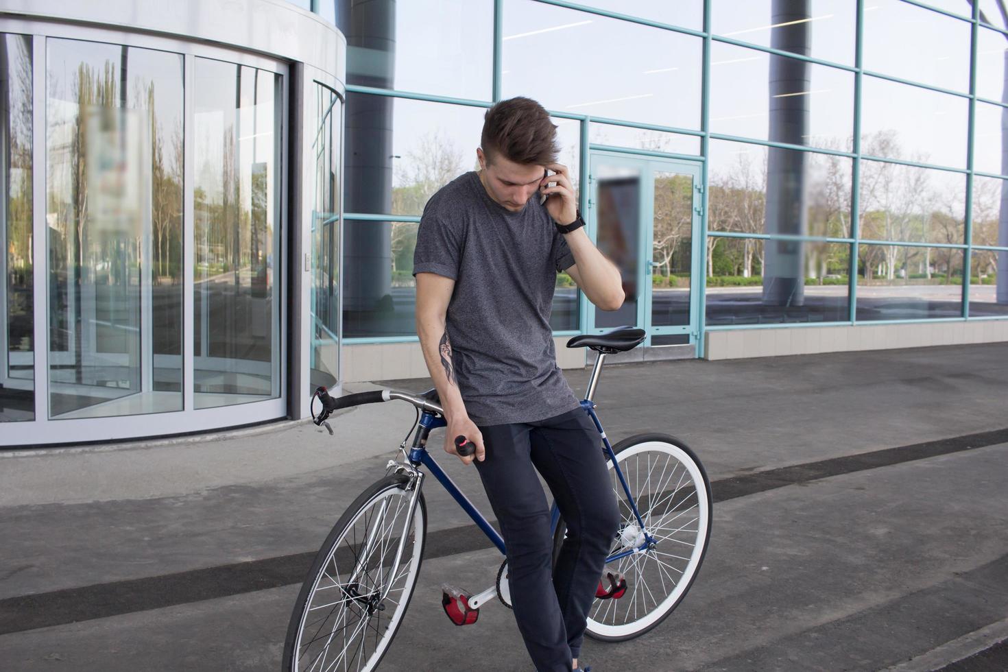 Cyclist man riding fixed gear sport retro bike. photo