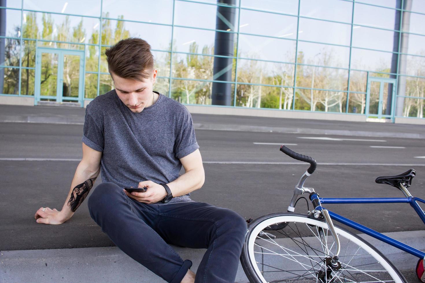 Cyclist man riding fixed gear sport retro bike. photo