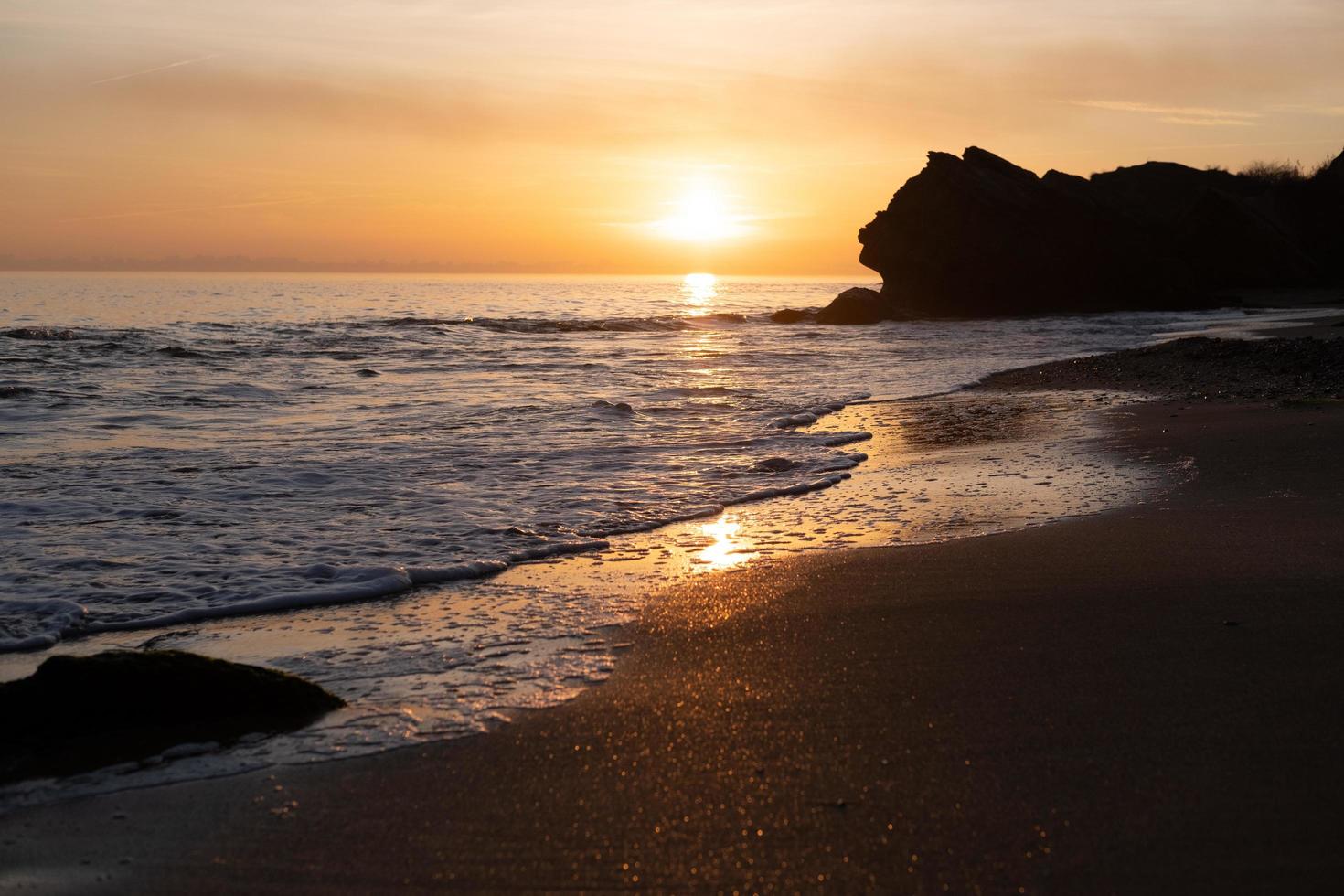 Beautiful landscape with sunset, cliffs and sea photo