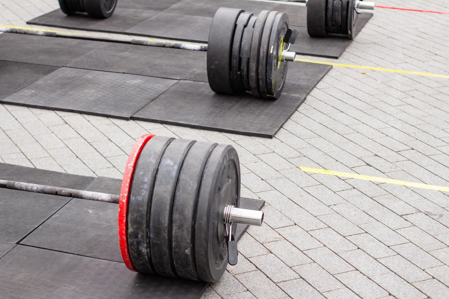 weight lifting equipment, outdoors powerlifting competition, closeups with athletic equipment photo