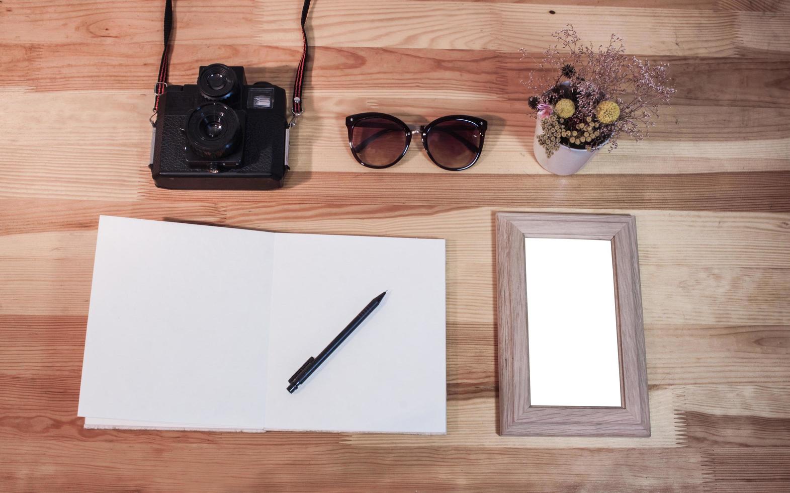 Wooden blank photo frames on table