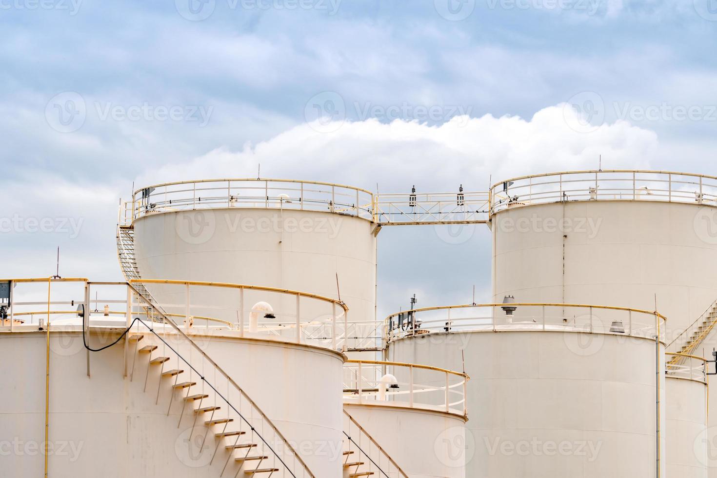 Closeup fuel storage tank in petroleum refinery. White big tank of oil storage. Fuel silo. Liquid petroleum tank. Petroleum oil industrial. Fuel station. Oil refinery plant. Petrochemical industry. photo