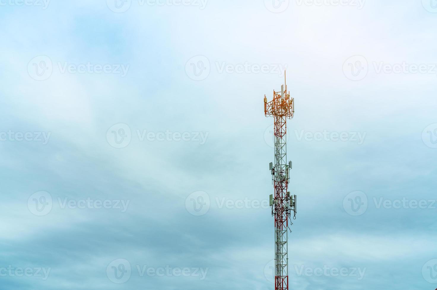 Telecommunication tower with blue sky and white clouds. Antenna on blue sky. Radio and satellite pole. Communication technology. Telecommunication industry. Mobile or telecom 4g network. Technology photo