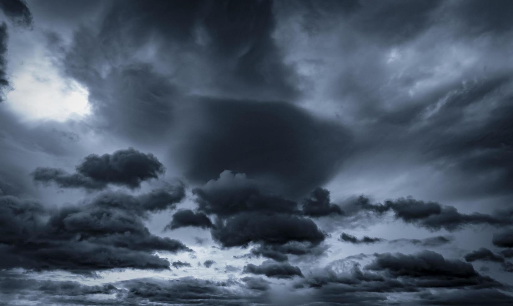 Dark dramatic sky and clouds. Background for death and sad concept. Gray sky and fluffy white clouds. Thunder and storm sky. Sad and moody sky. Nature background. Dead abstract background. Cloudscape. photo