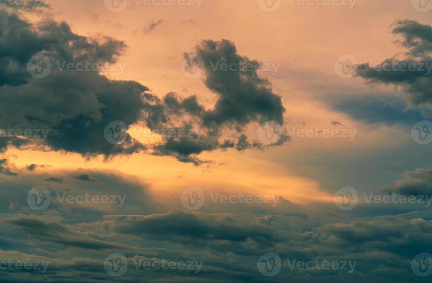 Sunset sky with gray and golden clouds. Gray sky and fluffy clouds. Thunder and storm sky. Sad and moody sky. Dead abstract background. Cloudscape. Peaceful and tranquil background. Beauty in nature. photo