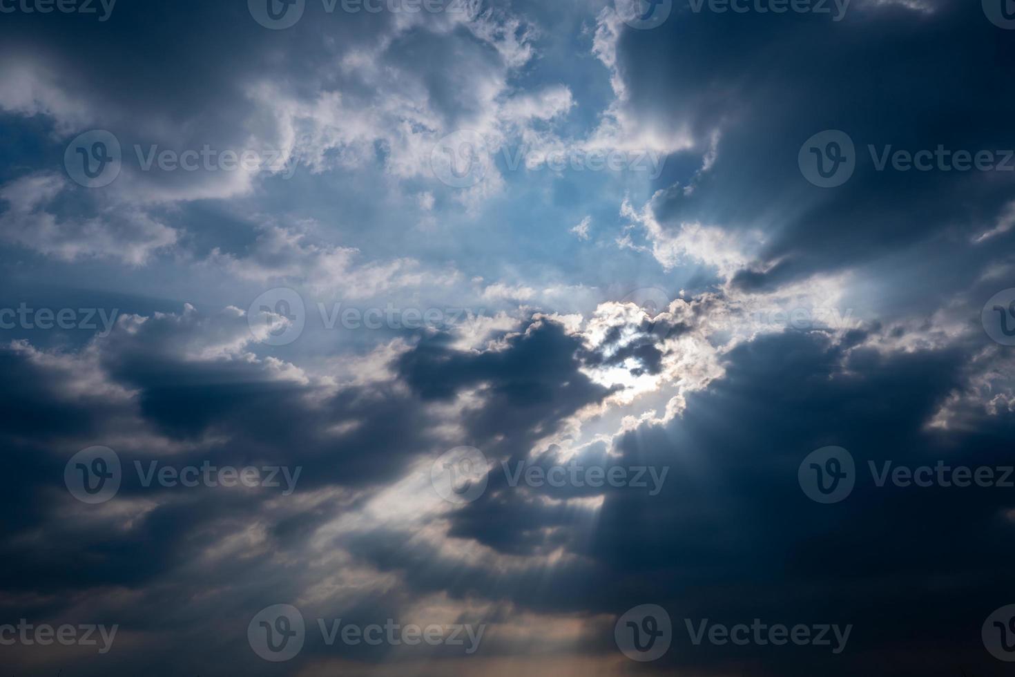 God light. Dark cloudy sky with sun beam. Sun rays through black clouds. God light from heaven for hope and faithful concept. Believe in god. Heaven sky. Overcast sky. Spiritual religious background. photo