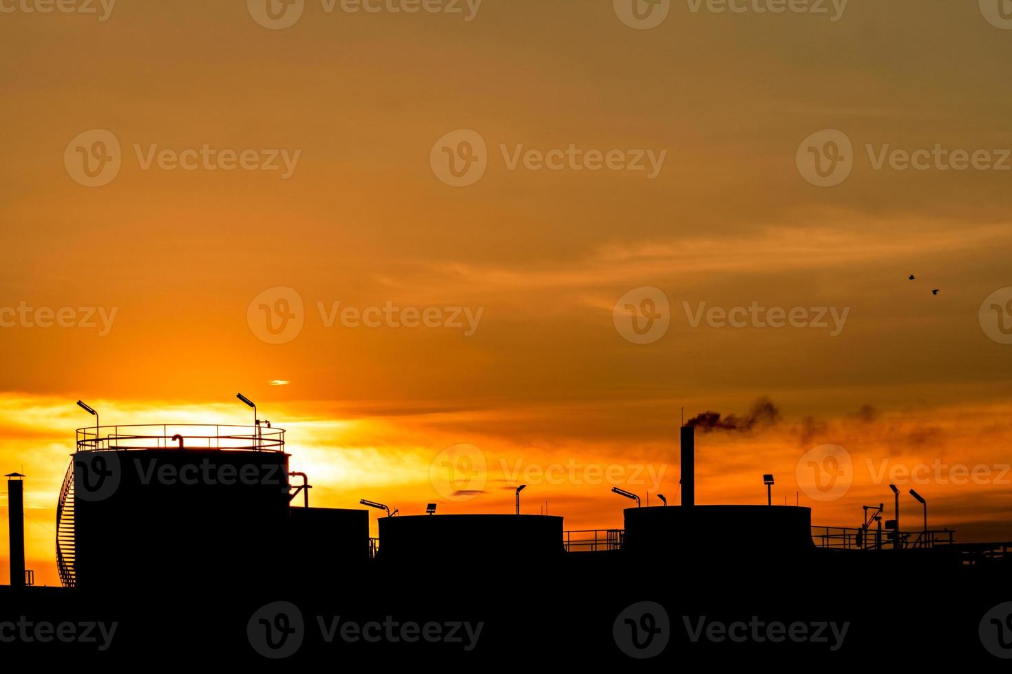 Gas turbine electrical power plant. Energy for support factory in industrial estate. Natural gas tank. Small gas power plant. Power plant using natural gas for fuel. Green energy. Dramatic sunset sky. photo