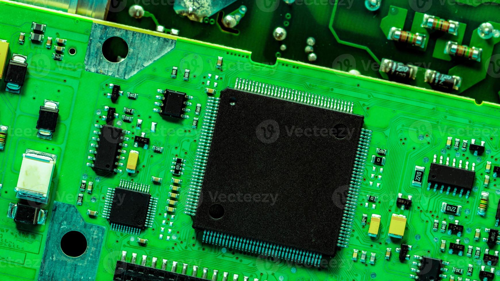 Electronic circuit board. Semiconductor motherboard circuit board technology. Mainboard of computer. Integrated semiconductor microchip on green circuit board. Hi-tech and semiconductor industry. photo