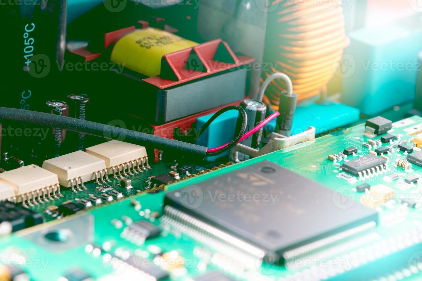 Electronic circuit board. Semiconductor motherboard circuit board technology. Mainboard of computer. Integrated semiconductor microchip on green circuit board. Hi-tech industry and computer science. photo