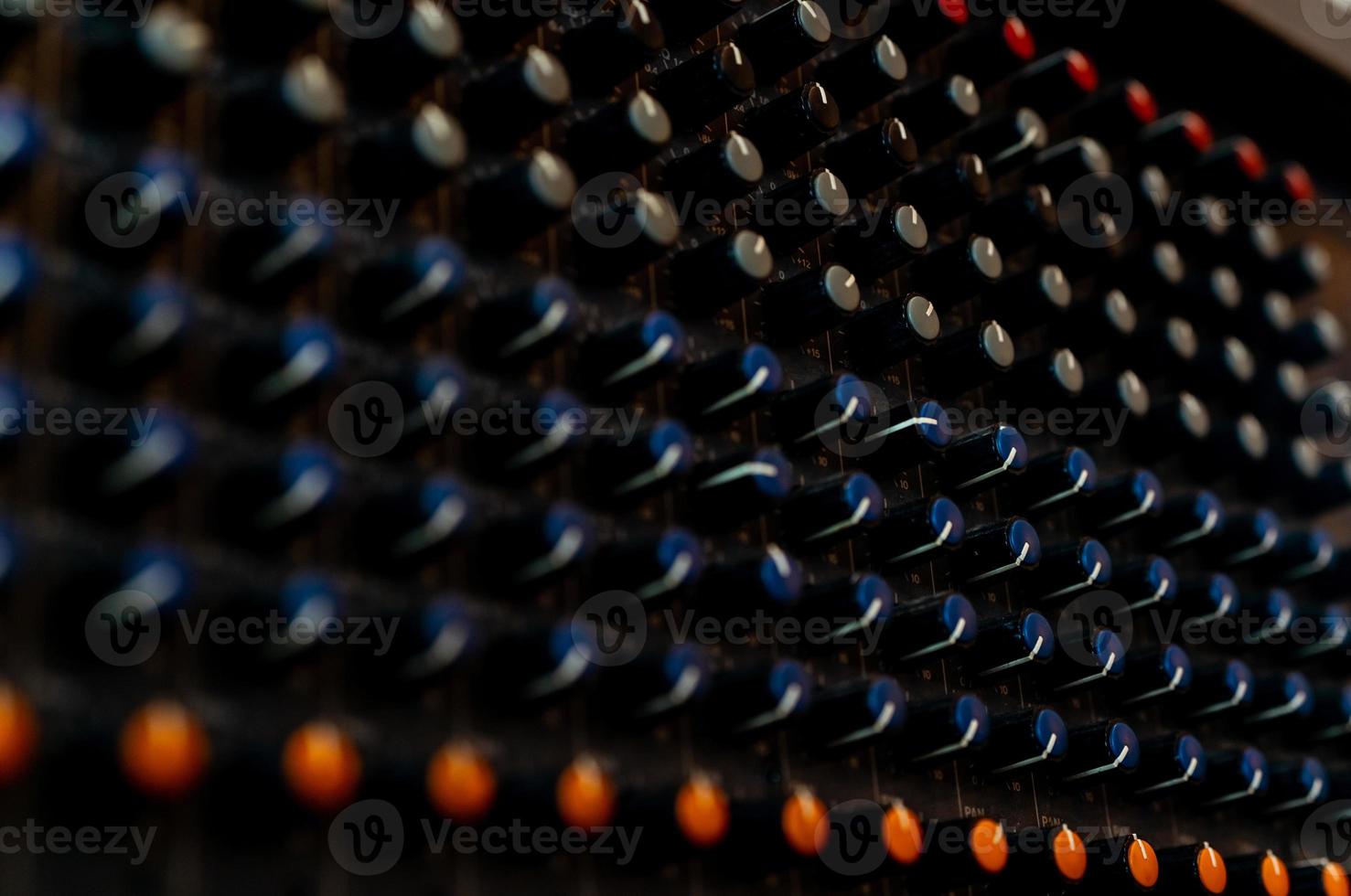 Audio sound mixer console. Sound mixing desk. Music mixer control panel in recording studio. Audio mixing console and adjusting knob. Sound engineer. Sound mixer control radio broadcasting. photo