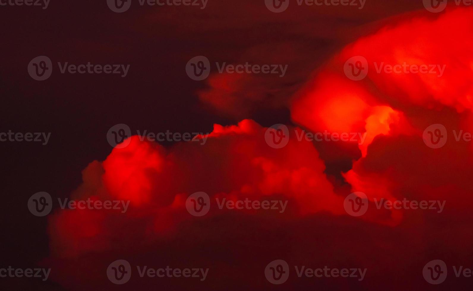 Red clouds with dark sunset sky. Red bloody clouds on dark sky. Evening twilight sky. Nature background for summer season. Dramatic red sky. Hell or heaven background. Beauty and magic in nature. photo